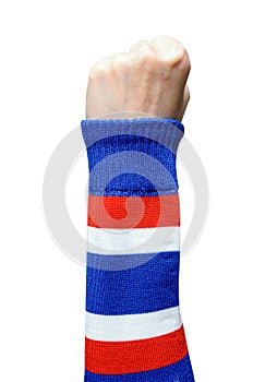 Woman hand in thailand armband making sign