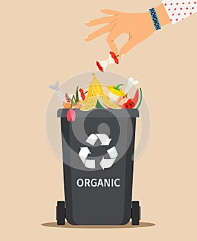 Woman hand throws organic garbage
