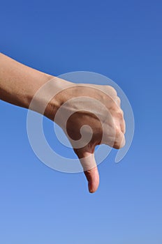 Woman hand thumb down