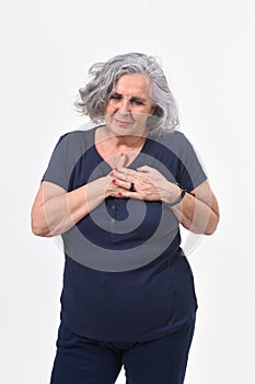 Woman with hand to the heart for a scare