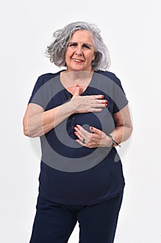 Woman with hand to the heart for a scare