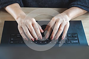 Woman hand typing on keyboard computer laptop searching job