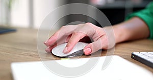 Woman hand use computer mouse on table