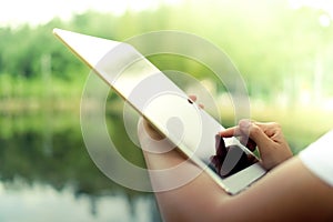 Woman hand using big tablet to do work.