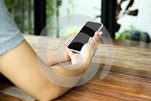 Woman hand using cell phone