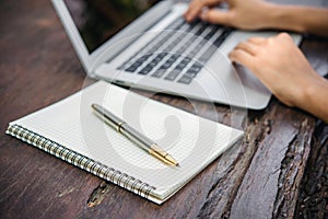 Woman hand using laptop computer