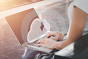 Woman hand using laptop computer with cloud computing icon, Cloud computing concept,