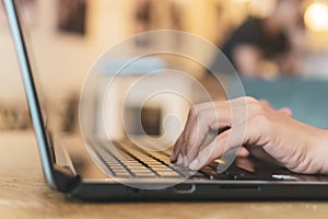 Woman hand using laptop to work study on work desk with clean nature background background. Business, financial, trade stock maket