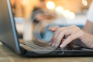 Woman hand using laptop to work study on work desk with clean nature background background. Business, financial, trade stock maket