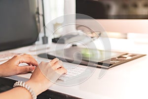 Woman hand using laptop to work study on work desk with clean nature background background. Business, financial, trade stock maket