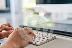 Woman hand using laptop to work study on work desk with clean nature background background. Business, financial, trade stock maket