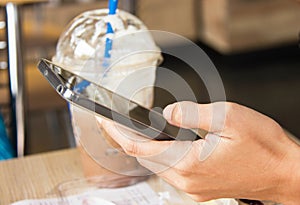 Woman Hand Using Smart Phone In Coffee Shop