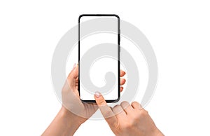 Woman hand using smartphone isolated on white background. Hand holding smartphone device and touching screen. Close up view of