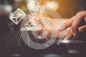 Woman hand using smartphone to send and recieve email.