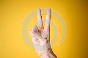 Woman hand victory gesture