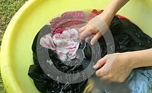 Woman hand washing clothes