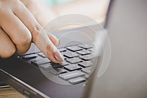 Woman hand work on computer laptop closeup ,work from home office