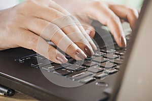 Woman hand work on computer laptop closeup ,work from home office