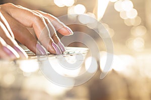 Woman hand working on computer laptop making money online from home