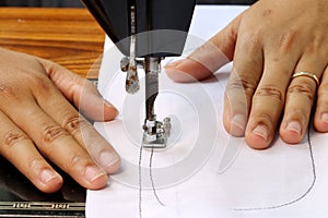 Woman hand, working with sewing machine