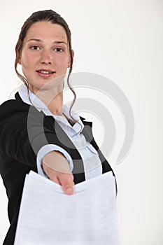 Woman handing over paperwork