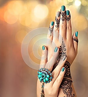 Woman Hands with black mehndi tattoo