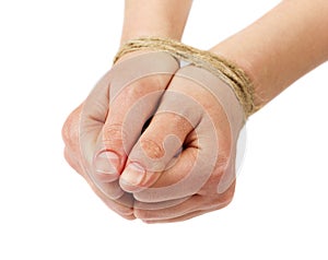 Woman hands bound by rope or string isolated on white