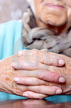 Woman with hands clasped