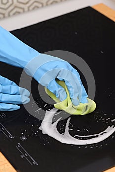 Woman Hands Cleaning A Modern Induction Hob