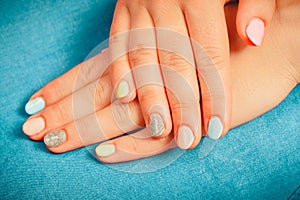 Woman hands with color nail polish. Manicure.