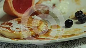 Woman Hands Cooking Souffle Pancakes dessert set.