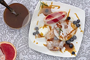 Woman Hands Cooking Souffle Pancakes dessert set.