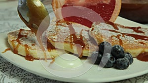 Woman Hands Cooking Souffle Pancakes dessert set.