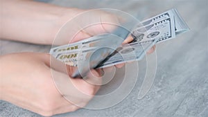 Woman hands counting Usa dollar banknotes.