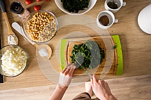 Woman hands, cutting onions