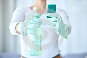 Woman, hands and detergent for housekeeping, cleaning or disinfect with latex gloves in sanitary home. Hand of female