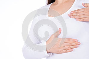 Woman hands doing breast self exam for checking lumps and signs of breast cancer isolated over white background. Medical,