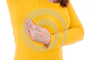 Woman hands doing breast self exam for checking lumps and signs of breast cancer isolated white background. Medical, healthcare