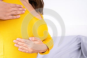 Woman hands doing breast self exam for checking lumps and signs of breast cancer. Medical, healthcare for advertising concept