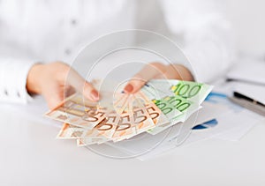 Woman hands with euro cash money