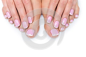 Woman hands and feet with french manicure