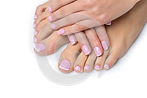 Woman hands and feet with french manicure