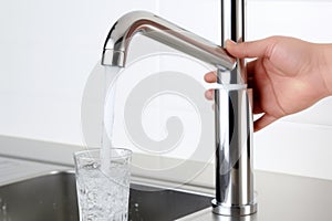 Woman hands filling glass tap water thirsty person pouring drink kitchen sink hand holding refreshing fresh filtered