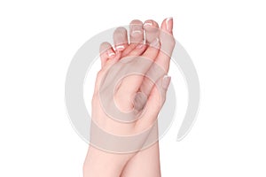 Woman hands with french manicure isolated on white bacckground
