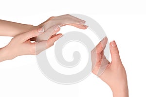 Woman hands with french manicure isolated on white bacckground