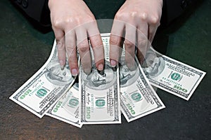 Woman hands hold and counting dollar banknotes