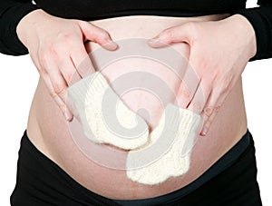 Woman hands holding baby socks