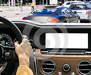 Woman hands holding car steering wheel of a modern car. Hands on steering wheel of a car driving. Girl driving a car inside cabin.