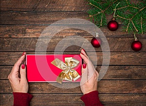 Woman hands holding Christmas present