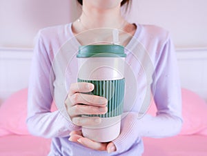 Woman hands holding coffee cup. Girl in sweater holding mug. Morning drink lifestyle.